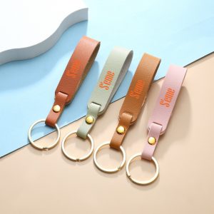 Móc khóa da simili in logo quảng cáo, nhiều màu sắc.